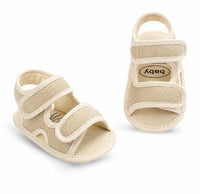 Sandale Bébé avec Lanières à Scratch en toile beige, double fermeture à scratch, bout ouvert, semelle souple et design confortable pour les premiers pas