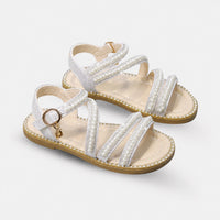 Sandale Fille avec Lanières Blanches et Perles Brillantes avec fines brides ornées de perles et strass, bride à la cheville réglable, semelle plate confortable et style élégant pour les cérémonies et occasions spéciales.