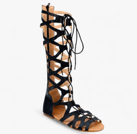 Sandale Gladiator Noire Montante avec Fermeture à Zipper, à lanières croisées, lacets montants, fermeture zippée à l'arrière, semelle plate et design gladiateur élégant