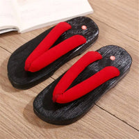 Sandale Japonaise Style Tong en Bois Unisexe, de couleur rouge avec semelle noire.